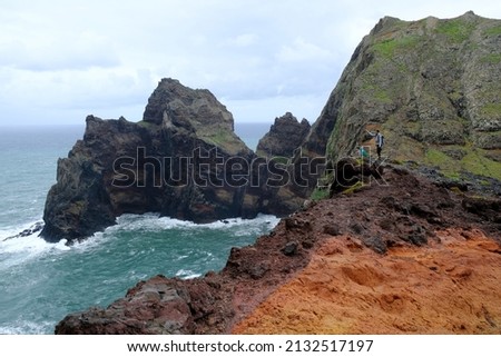 Ponta de Sao Lourenco (Saint Lawrence Peninsula) is the easternmost point on the Madeira map. A miracle of nature. Amazing colorful rocks. Silhouettes of people on trail. Madeira, Portugal