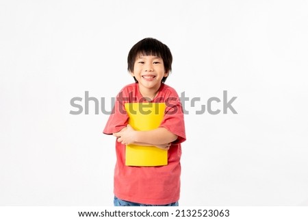 Portrait of Happy asian boy with books isolated on white background, Education and learning with technology concept