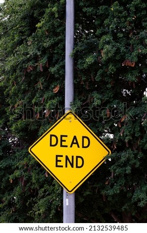 Dead end road sign on city street