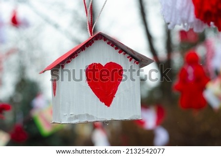 Cardboard house hanging in the tree Stock photo