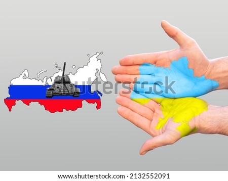 Hands of Ukraine tanks with map Russia