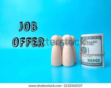 Wooden people figures and banknotes with text JIB OFFER on a blue background.