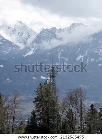 Radio antenna in front of a mountain
