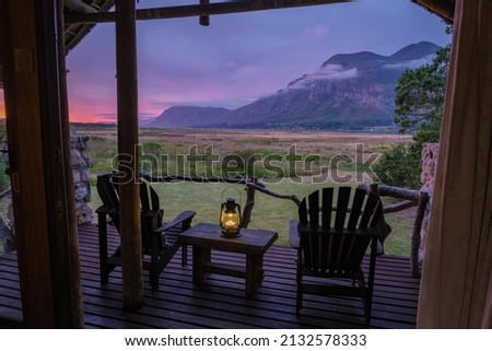 cabin lodge during sunset Mountains and grassland near Hermanus at the garden route Western Cape South Africa Whale coast.  Royalty-Free Stock Photo #2132578333