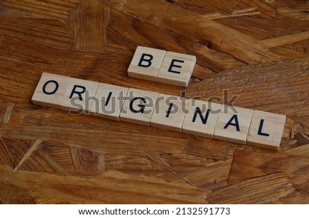 Be original text on wooden square, motivation and business quotes