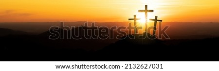 Easter background banner panorama religious greeting card Crucifixion and Resurrection. Three crosses of Golgotha by sunset.  Royalty-Free Stock Photo #2132627031