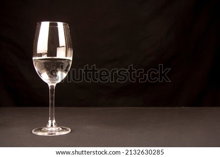 glass of champagne isolated on black background