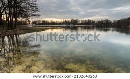 Evening mood with reflections in the Silbersee, Germany, Lower Saxony, Hanover, Langenhagen