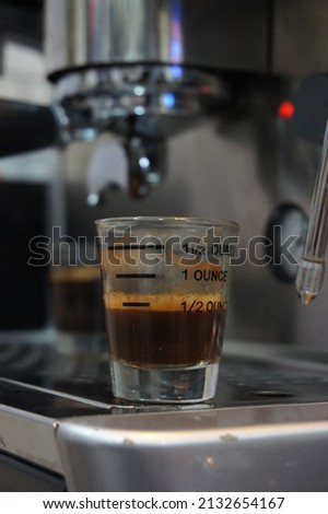 Isolated background of black espresso on small cup