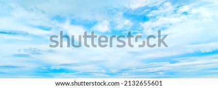 Beautiful blue sky and white clouds of various shapes with sunlight. Nature background Royalty-Free Stock Photo #2132655601