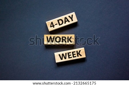 4-day work week symbol. Concept words 4-day work week on wooden blocks on beautiful black table black background. Copy space. Business and 4-day work week and short workweek concept. Royalty-Free Stock Photo #2132665175