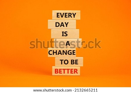 Change to be better symbol. Wooden blocks with words Every day is a change to be better. Beautiful orange table, orange background, copy space. Business, motivational change to be better concept.