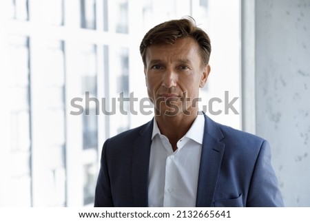 Portrait of skilled professional male middle aged financial advisor lawyer employee ceo executive manager leader employee worker in formal wear posing in modern office, corporate career concept. Royalty-Free Stock Photo #2132665641