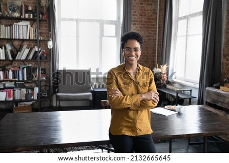 Happy confident young Black business woman, freelance professional, entrepreneur head shot portrait. Cheerful short haired female leader, employee posing in home office. Corporate head shot portrait