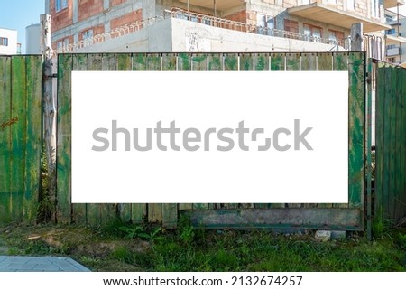 Blank white banner for advertisement on t he fence of construction site