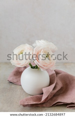 white ranunkel in flower vase - fine art picture