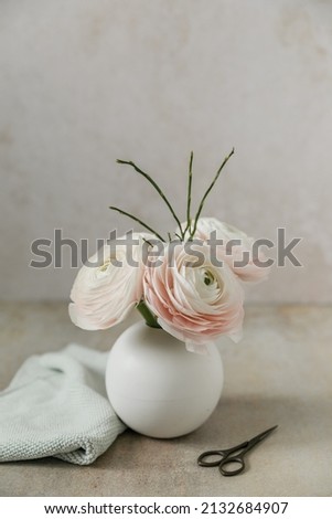 white ranunkel in flower vase - fine art picture
