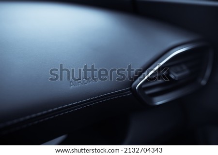 Close up shot of the airbag on the passenger side of a car.  Royalty-Free Stock Photo #2132704343