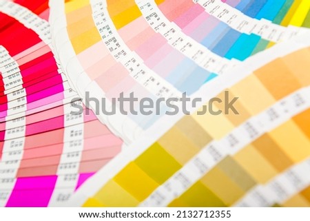 Several color guides spread out in fan shape. Color, colorful, design  image