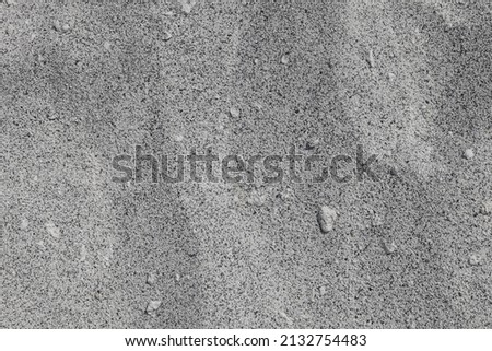 Sand Texture. Black and white sand. Background from fine sand. Close-up image.