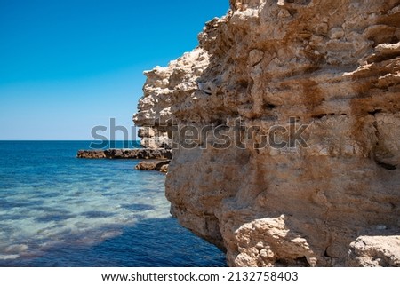 Beautiful white rocks on the background of the sea. Summer coastline landscape. Travel and holidays in the south.