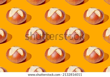 Pattern of buns on yellow pastel background