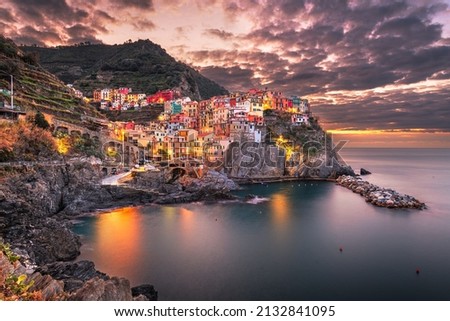 Manarola, La Spezia, Italy coastal view in Cinque Terre at dawn.