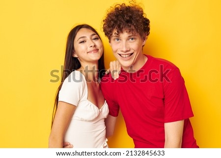 portrait of a man and a woman together posing emotions close-up yellow background unaltered Royalty-Free Stock Photo #2132845633