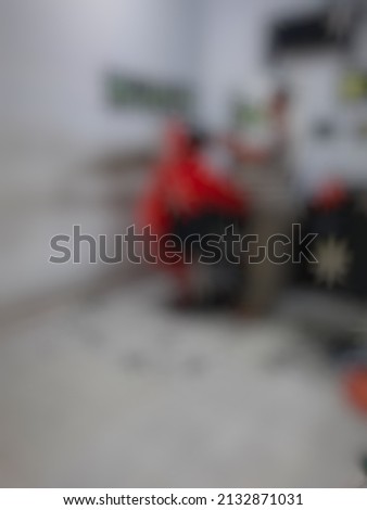 Defocused abstract background of getting a new haircut at barbershop
