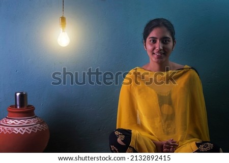 Teenage rural girl sitting at home Royalty-Free Stock Photo #2132892415