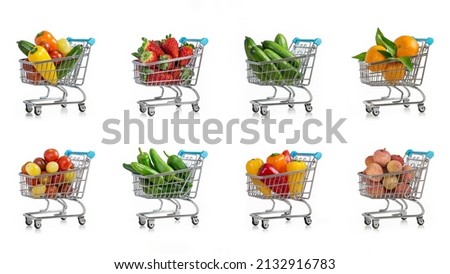 Fresh fruits and vegetables in a metal shopping cart. Pattern, template, wallpaper on white.