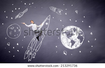 Young businessman flying in sky on drawn rocket