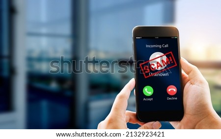 Phone Scam, fraud or phishing concept.Unknown caller show on mobile phone screen. Royalty-Free Stock Photo #2132923421