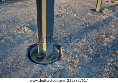 installation of traffic noise barrier begins with concreting of columns made of steel cross-beams  drilled hole is fitted with sheet metal and a steel beam is poured into it with concrete, car railway