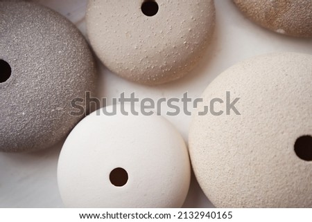 Assorted ceramic wares arranged on table in pottery studio Royalty-Free Stock Photo #2132940165