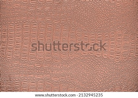 Orange coral crocodile leather texture. Abstract background for design.