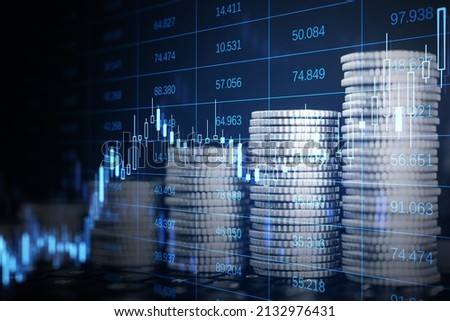 Abstract image of growing coin stacks and candlestick forex chart on blurry background. Trade, money and financial growth concept. Double exposure
