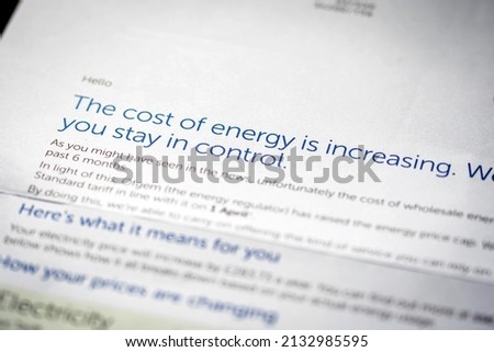 Paper electricity bill with cost increasing notice in England UK Royalty-Free Stock Photo #2132985595