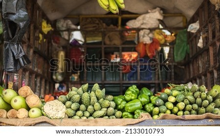 Fresh vegetables placed in a vegetable van by a vendor.