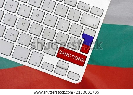 White computer keyboard with button of flag Russia and red button with word of sanctions on Bulgaria flag background. Financial and economic regulation sanctions Bulgaria against of Russia