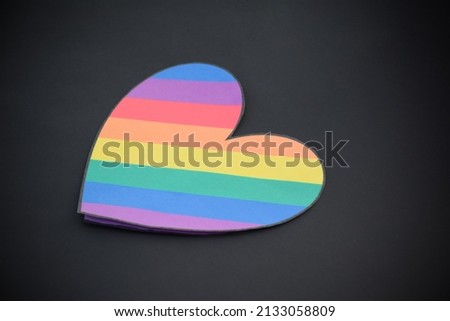 Rainbow colored paper cut out in the shape of a heart, concept for LGBTQ+ community celebration in pride month and special lgbtq+ occasion around the world.