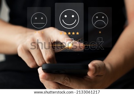 User give rating to service experience on online application, Customer review satisfaction feedback survey concept, Customer can evaluate quality of service leading to reputation ranking of business. Royalty-Free Stock Photo #2133061217