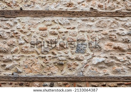The texture of the beige stone wall. Background texture of the stone wall