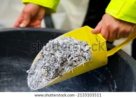 Plastic granulate in a plastic waste recycling plant Royalty-Free Stock Photo #2133103511