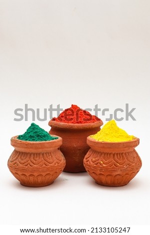 Indian festival Holi concept :- bowl with colors of holi on white background. Royalty-Free Stock Photo #2133105247