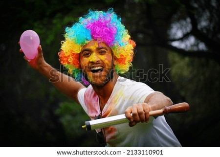 Young Indian playing Holi Images Royalty-Free Stock Photo #2133110901