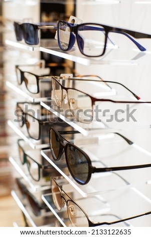 A closeup of Different eyeglasses in the eyewear shop Royalty-Free Stock Photo #2133122635