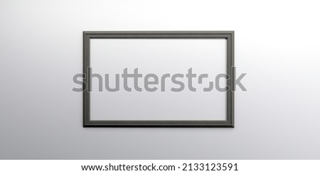 An empty wall with blank picture frames