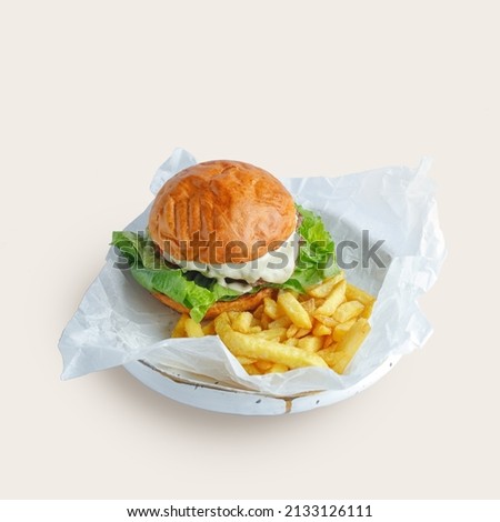 appetiziappetizing burger traditional serving on a plate with sauce and fried potatoesng burger traditional serving on a plate with sauce and fried potatoes