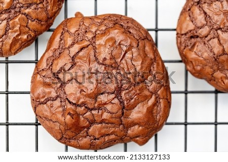 Delicious isolated Cookie homemade with chocolate, cocoa, chocolate chip and baked. Picture top view, 90 degrees with white background and black grid.